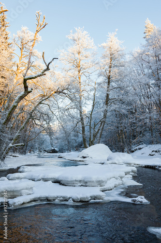 Ice and snow in the river that runs through the forest © Lars Johansson