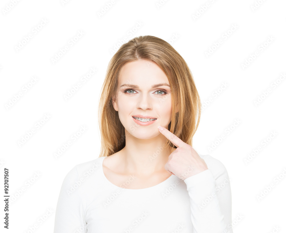 Attractive teenage girl smiling in teeth retainer. Stomatology concept. Attractive teenage girl smiling in teeth retainer. Stomatology concept.