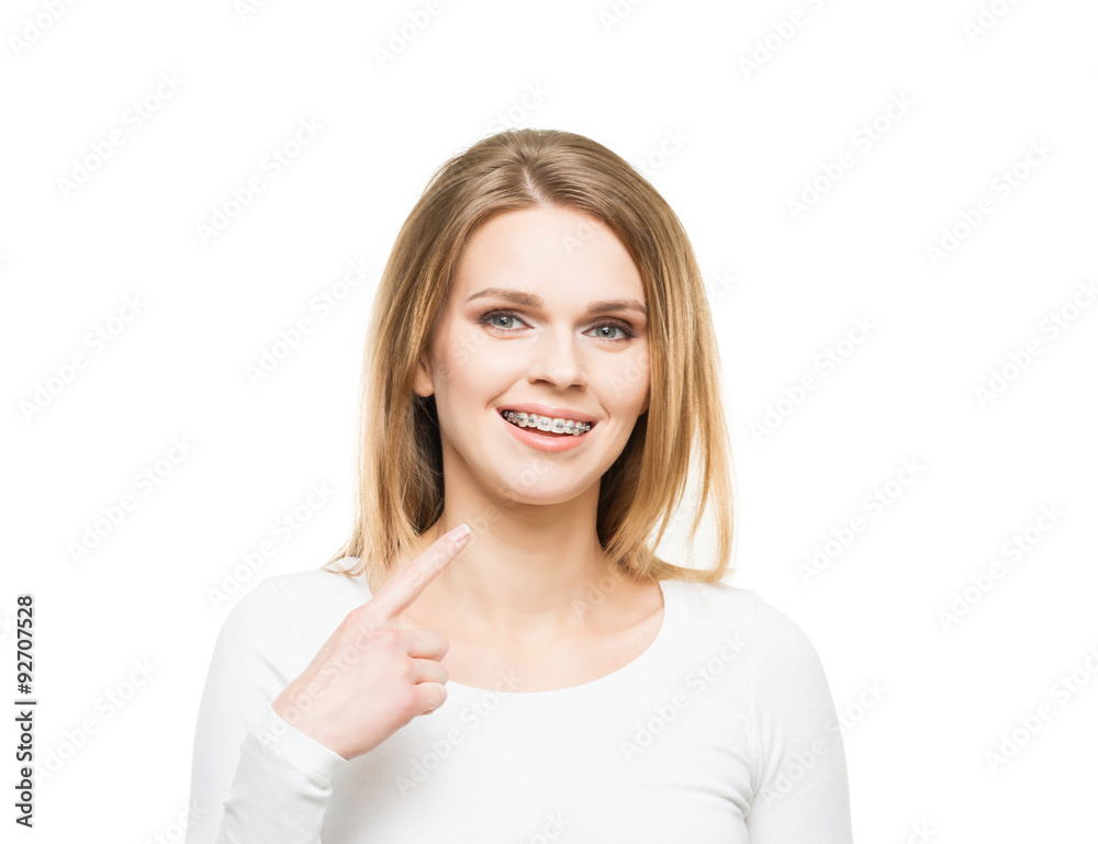 Attractive teenage girl smiling in dental braces. Stomatology concept. Attractive teenage girl smiling in dental braces. Stomatology concept.
