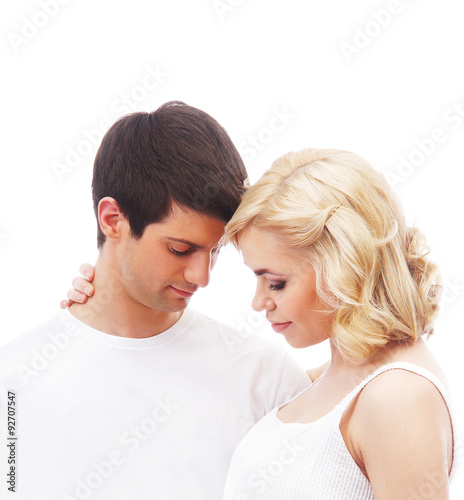Young attractive couple: pregnant mother and happy father isolat