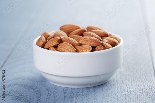 roasted almonds in white bowl photo