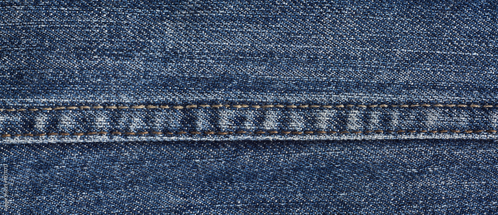Denim fabric texture with stitching macro close-up textile background Denim fabric texture with stitching macro close-up textile background