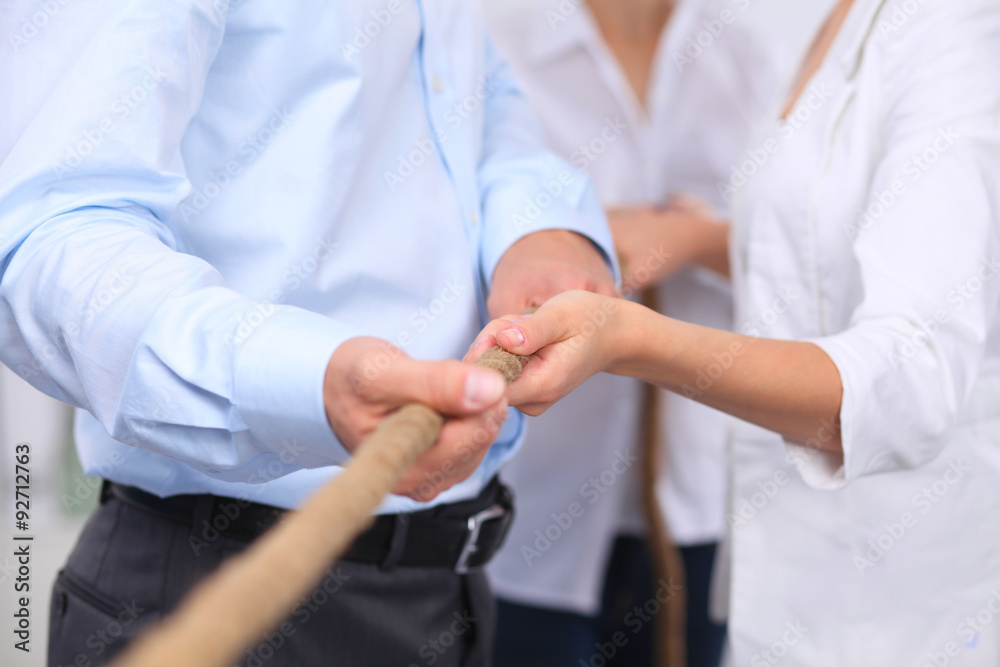 Concept image of business team using a rope as an element the Concept image of business team using a rope as an element the