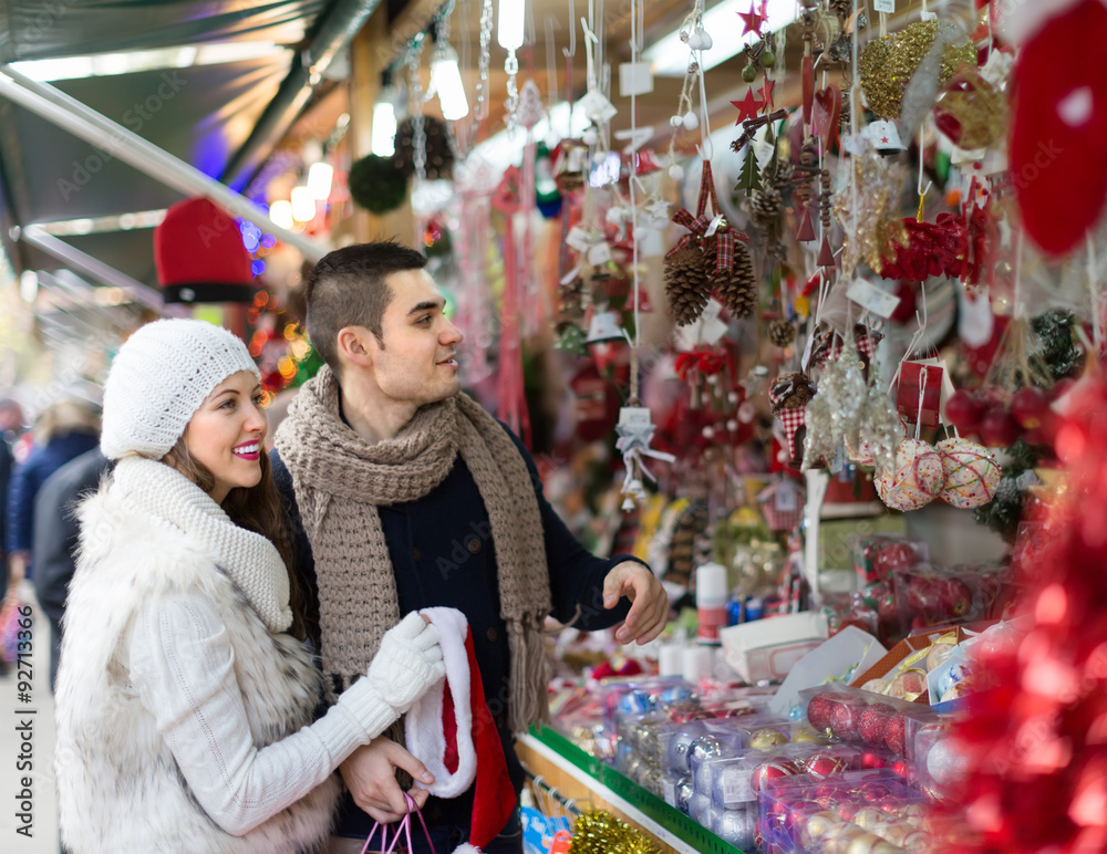 Young man with girlfriend at  X-mas market