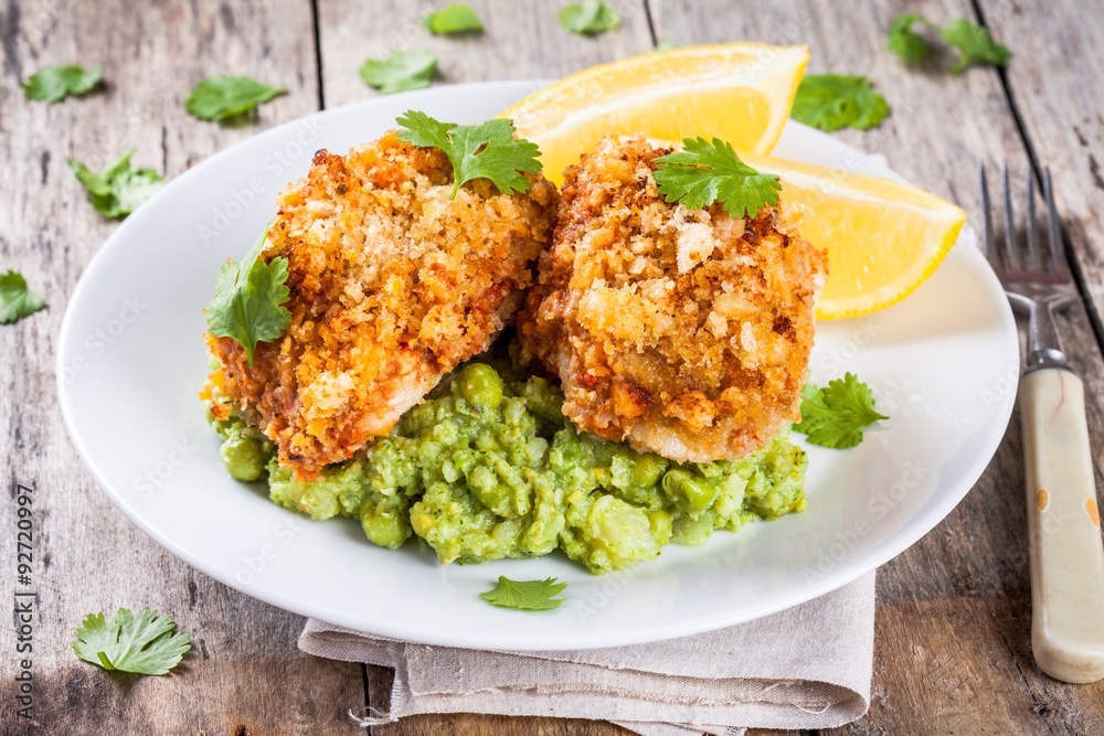 Baked cod fish in breadcrumbs with mashed green peas and broccoli Baked cod fish in breadcrumbs with mashed green peas and broccoli
