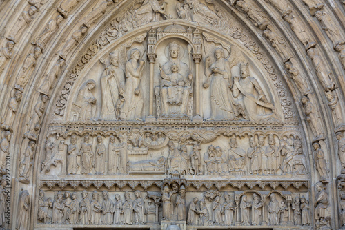 Paris - West facade of Notre Dame Cathedral. The Saint Anne portal and tympanum