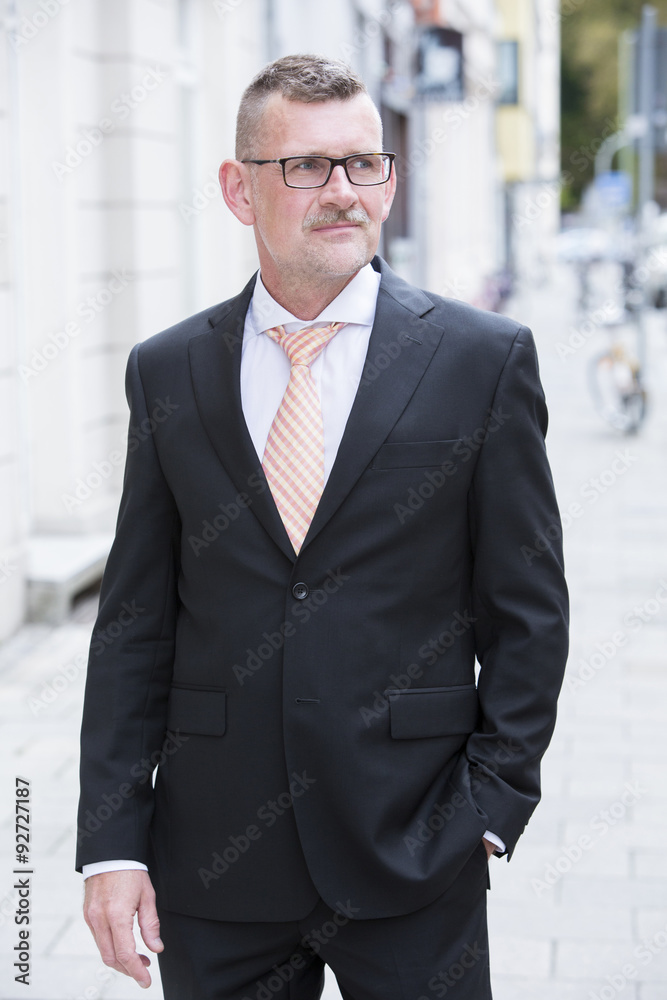 portrait of businessman standing in the street portrait of businessman standing in the street