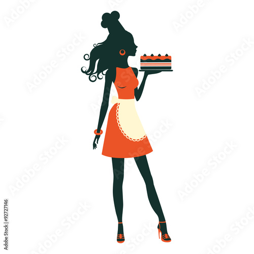 Beautiful baker holding freshly baked cake
