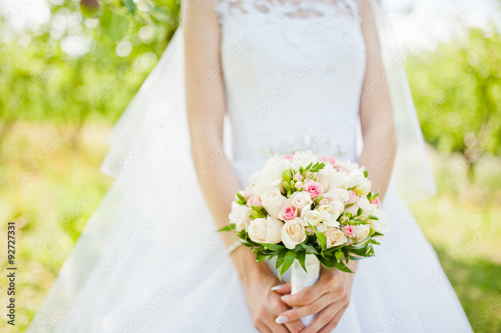 tender wedding bouquet at hand of bride tender wedding bouquet at hand of bride