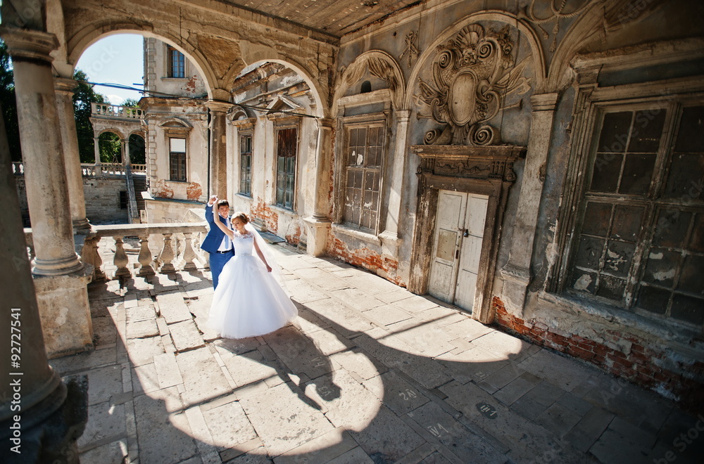 Tender wedding couple background old architecture of castle