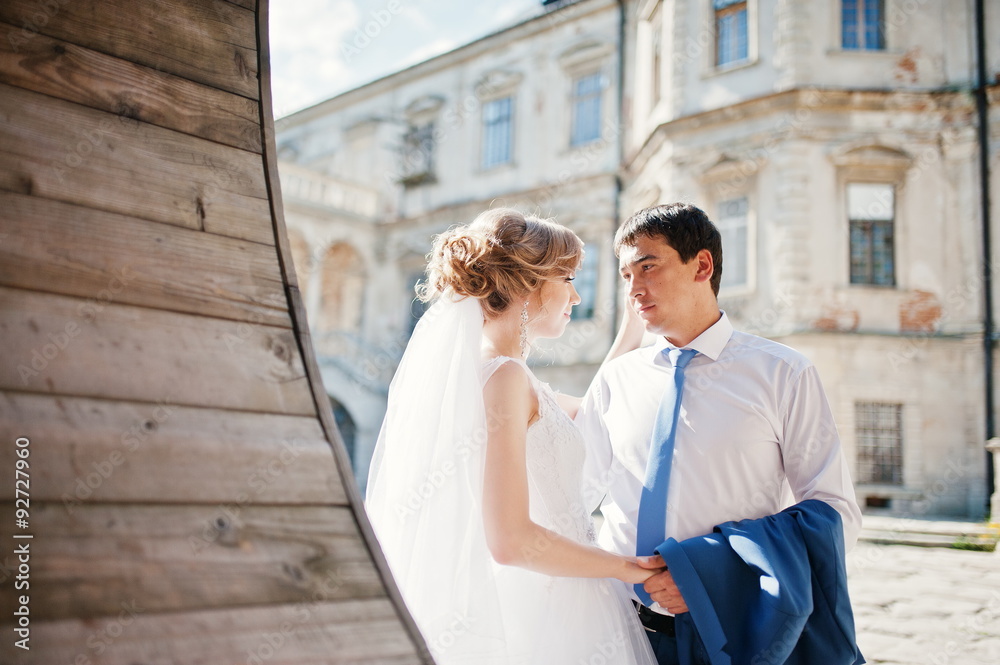 Tender wedding couple background old architecture of castle