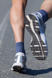 Running shoes on runner