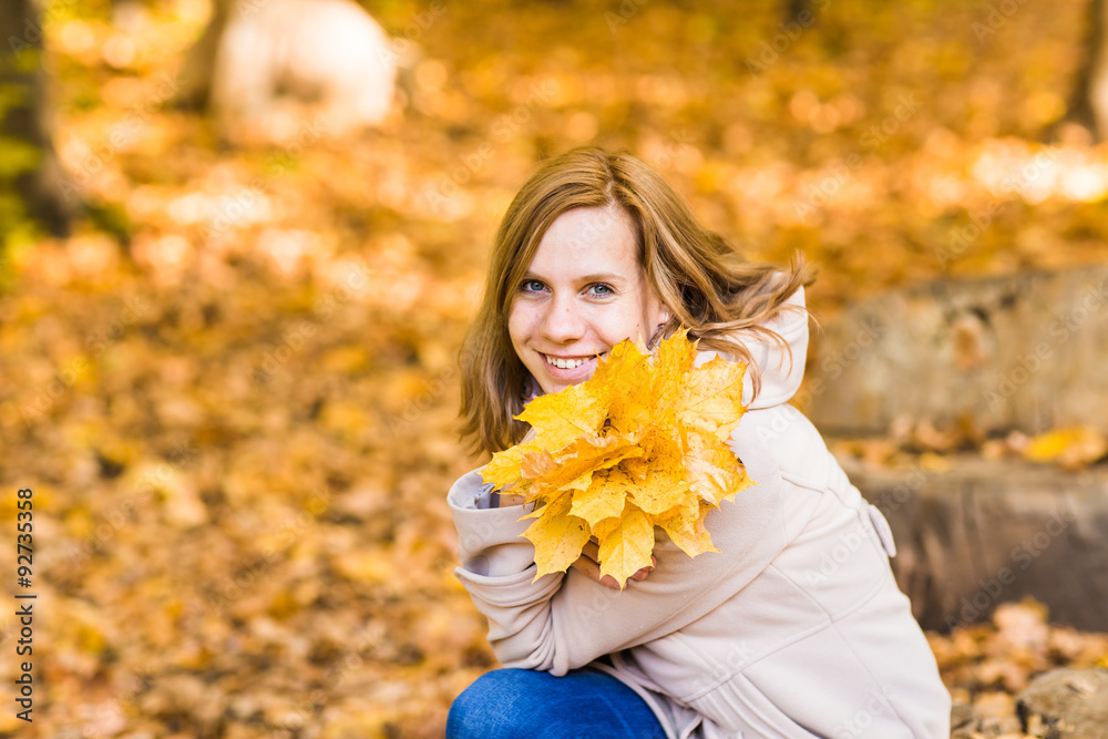 Young woman with autumn leaves Young woman with autumn leaves