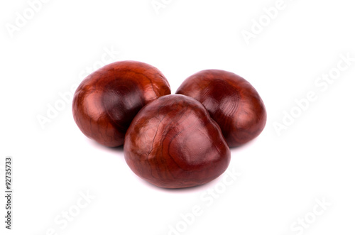Three chestnut without shell isolated on white background