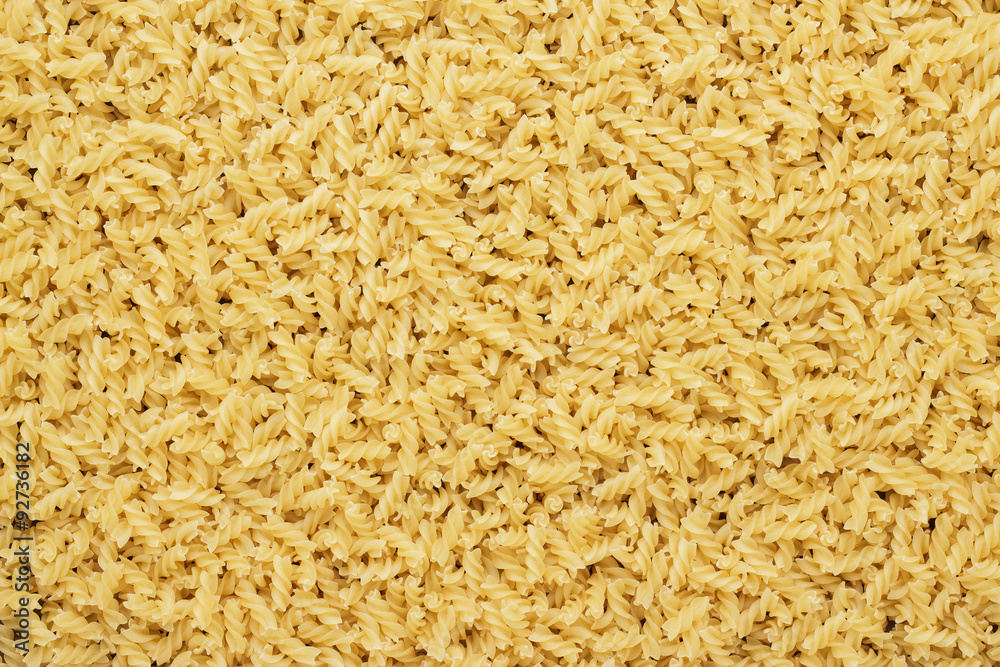 dry uncooked rotini texture background dry uncooked rotini texture background