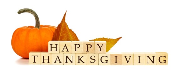 Happy Thanksgiving wooden blocks with pumpkin and autumn leaves isolated on white