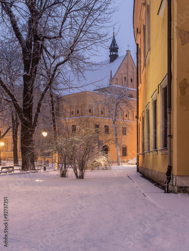 Krakow, Poland,Planty park and old church in the morning during snow.