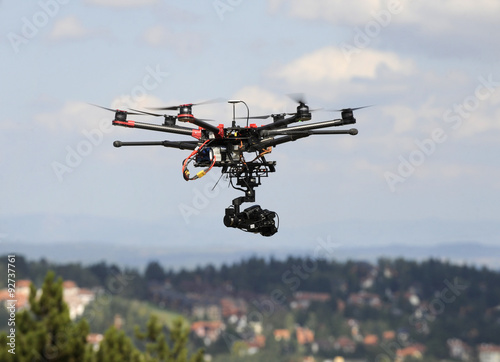 A drone with a camera flying high