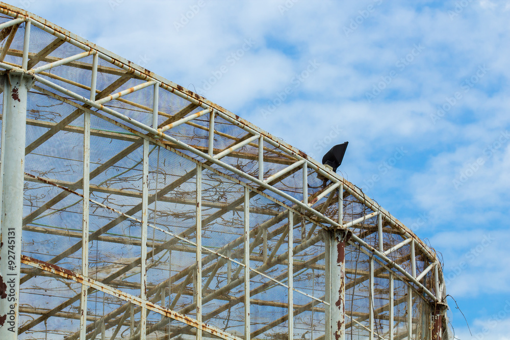 Big cage of bird with blue sky and cloud.