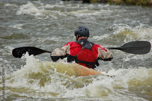 Kayaker training on a rough water. Southern Bug river, Ukraine.