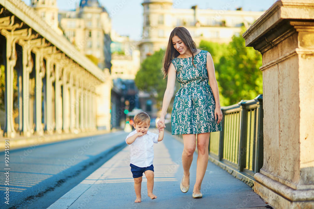 Young mother with her little son in Paris