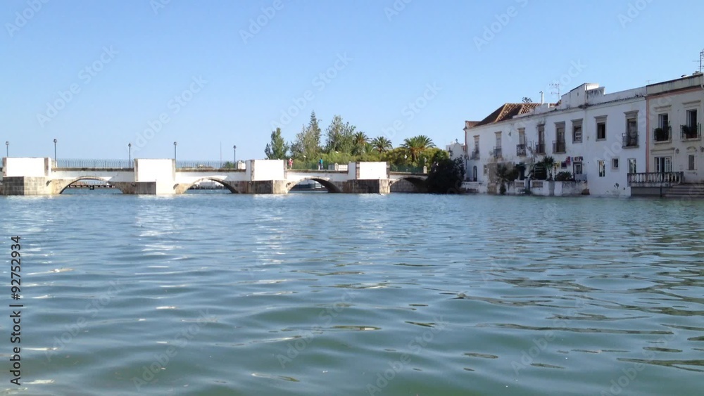 Old roman bridge of the old town Tavira in the south of Portugal. Overview for the houses of one of the oldest towns in Portugal. Old roman bridge of the old town Tavira in the south of Portugal. Overview for the houses of one of the oldest towns in Portugal.