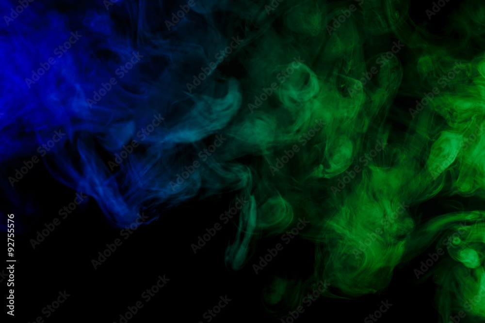 Obraz premium Abstract blue and green smoke hookah on a black background.