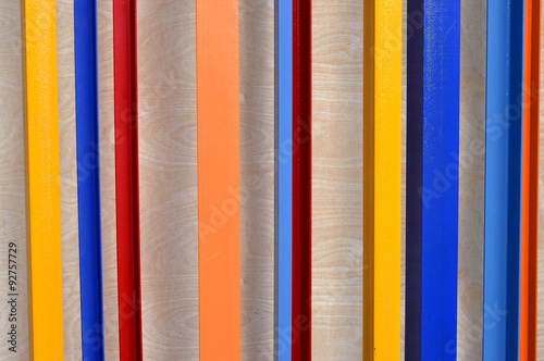 Colorful lines on the wooden wall