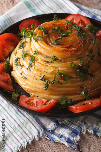 French food: timbale of pasta with cheese and vegetables close-up
 photo