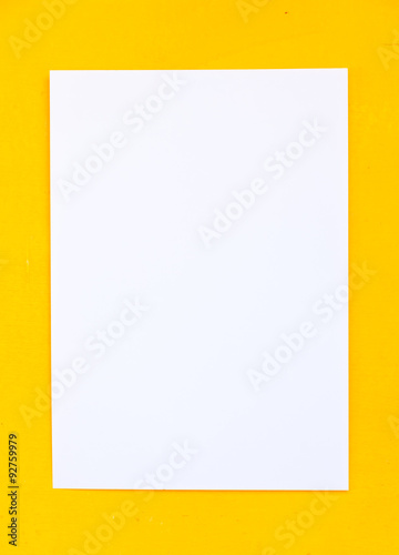 Blank Paper on yellow background.