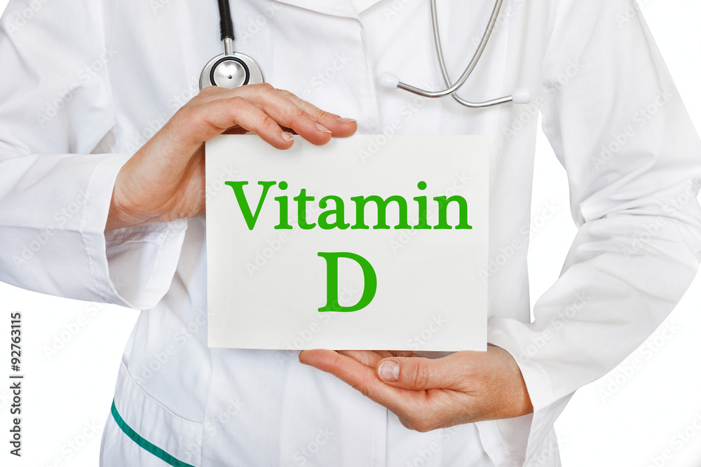 The female doctor, with the plate Vitamin D, medical concept The female doctor, with the plate Vitamin D, medical concept
