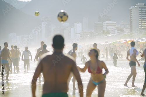Brazilian men and women play keepy uppy on the shore of Ipanema Beach at Posto 9, a famous gathering place for the game, called altinho. photo
