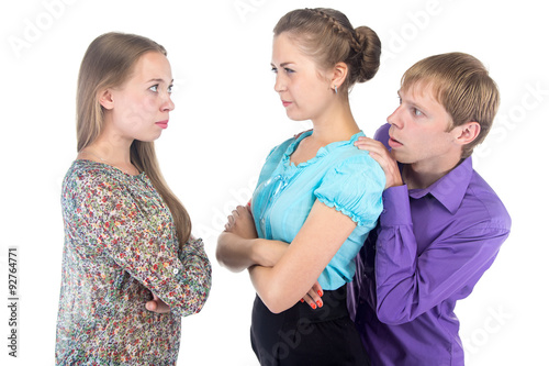 Cowardly blond man and two young women