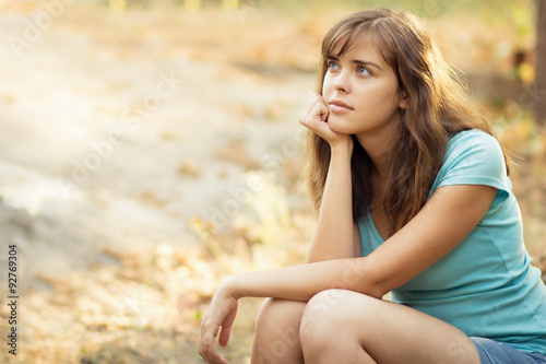 portrait of a beautiful young woman in nature