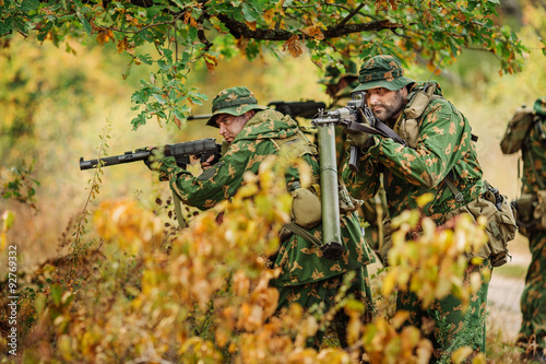 Russian special forces operator in the battlefield with a rifle photo