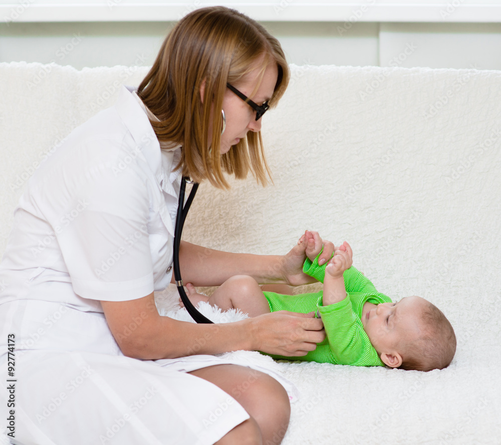 doctor examining newborn baby with stethoscope doctor examining newborn baby with stethoscope