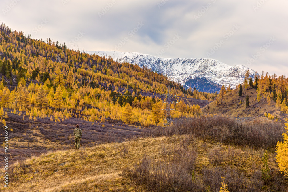 photographer takes autumn landscape