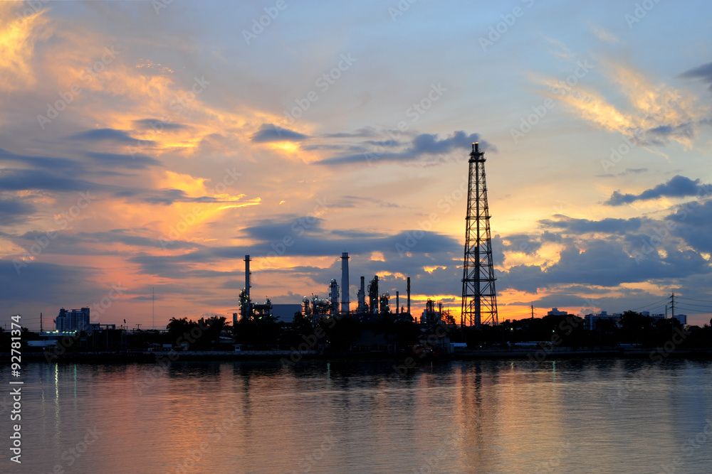 Petrochemical plant in night time with reflection over the river