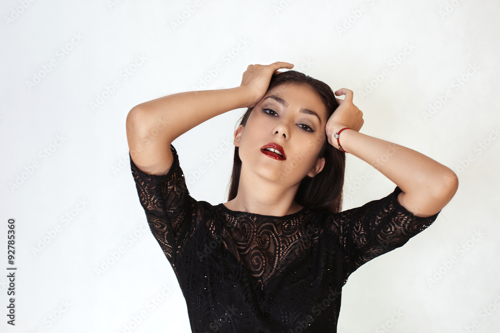 Beautiful stylish girl holding his head
