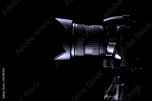 Professional DSLR camera on dark background