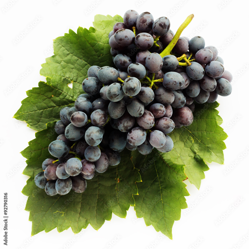 Fototapeta premium Grape on leaf isolated on white background