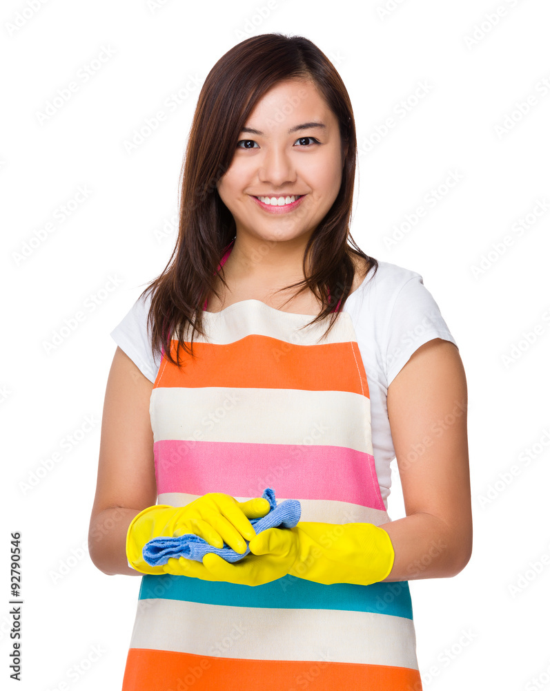 Asian young housewife hold with rubber gloves and rag Asian young housewife hold with rubber gloves and rag