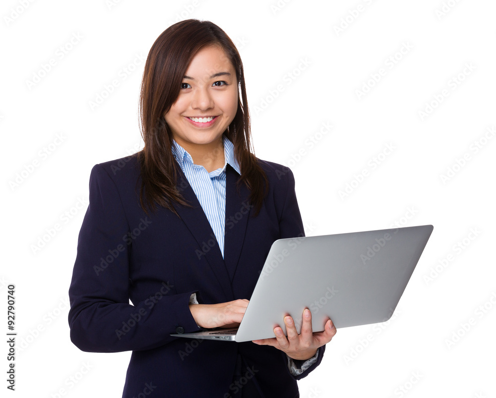 Asian businesswoman use of the notebook computer Asian businesswoman use of the notebook computer