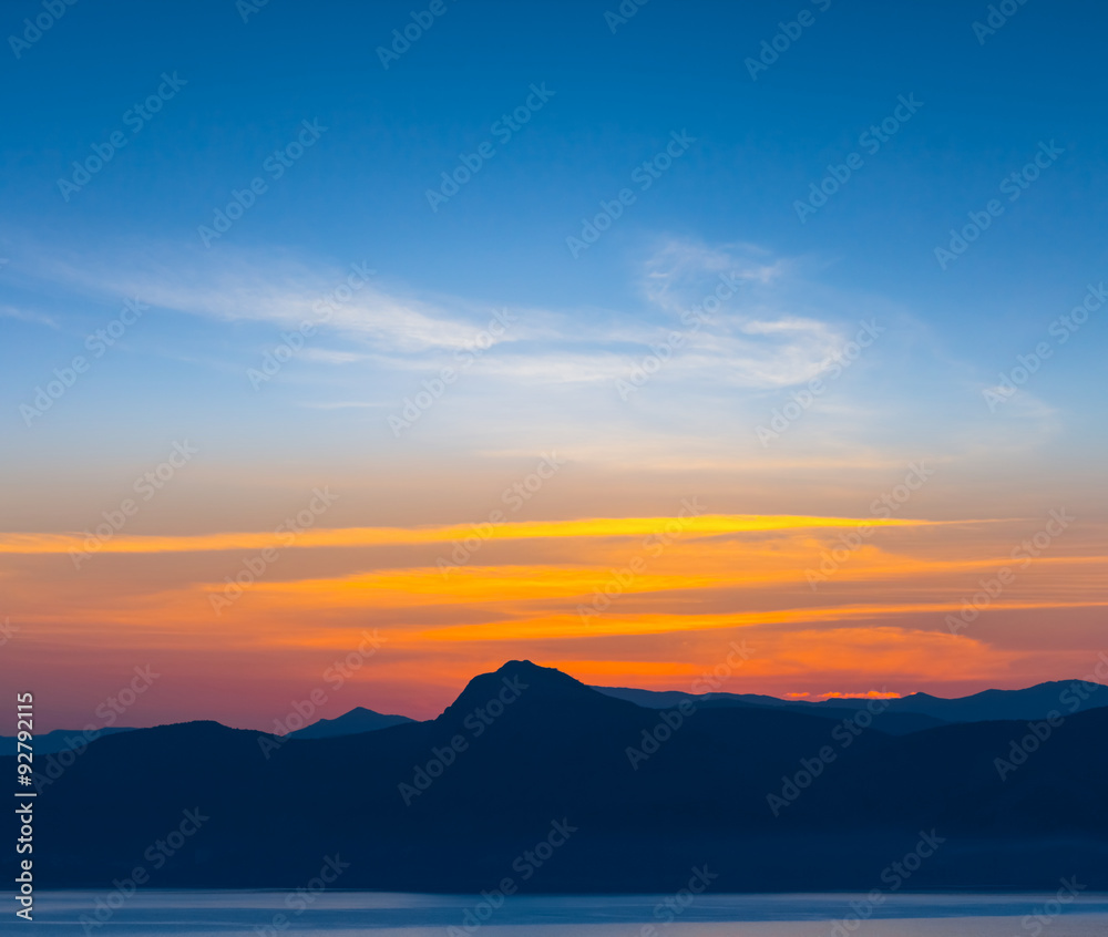 Fototapeta sunset over a hills background