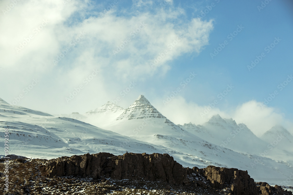 Snow-covered volcanic mountain landscape in Iceland