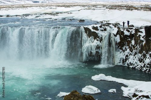 Tourists at the Icelandic waterfall Godafoss in wintertime © BirgitKorber
