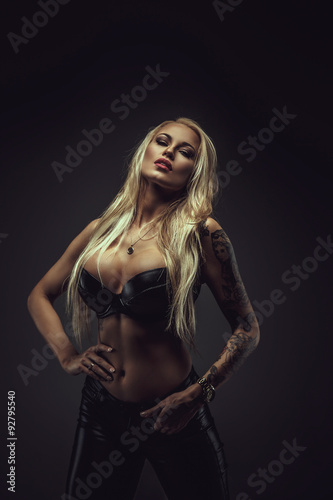 Sexy blond woman in black bra. © Fxquadro