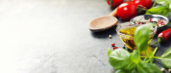 Wooden spoon and ingredients on old background