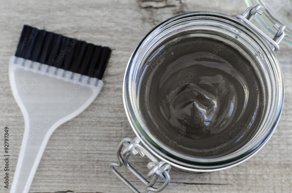 Black volcanic cosmetic clay in a glass jar Black volcanic cosmetic clay in a glass jar