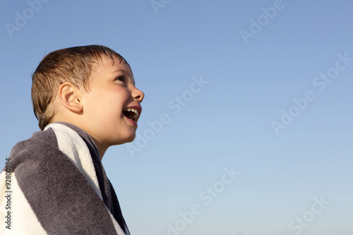 Happy boy on a sky background